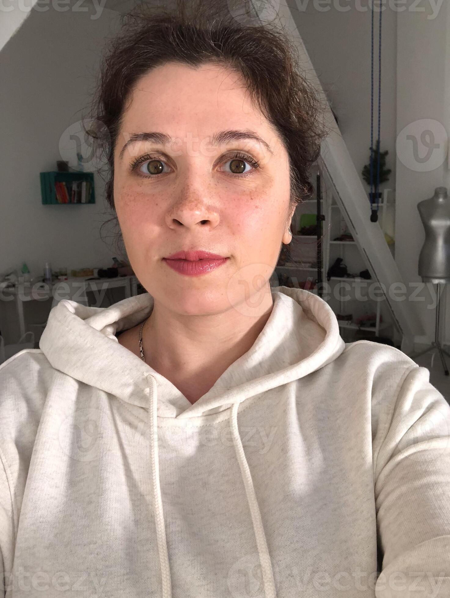 files/selfie-portrait-of-woman-in-cozy-hoodie-relaxing-at-home-natural-portrait-in-a-modern-domestic-setting-comfort-in-simplicity-everyday-authenticity-and-serene-domestic-life-concept-pho.jpg